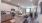 Model kitchen at our apartments in Aubrey, featuring a kitchen island with counter seating and stainless steel appliances.